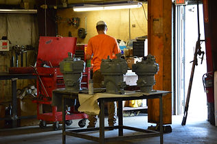 man fixing train parts